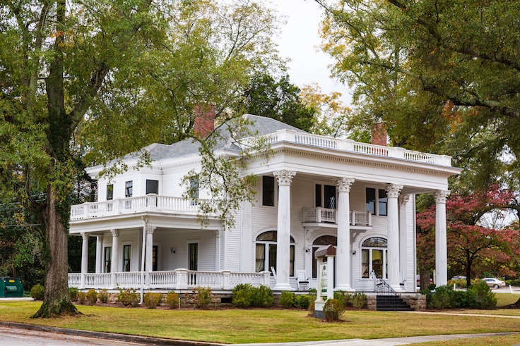 Covington Georgia USA 11-15-2024 beautiful old mansion in town on a cloudy day in late fall