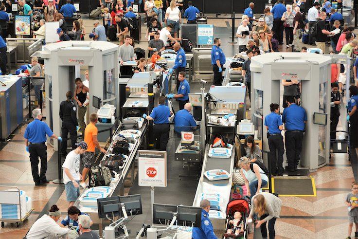 Denver, CO, USA. July 27, 2019. Travelers in long lines at Denver International Airport going thru the Transportation Security Administrations (TSA) security screening areas to get to their flights.