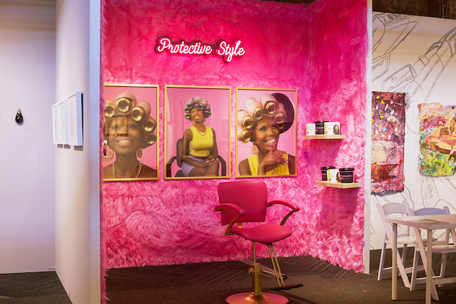 a hot pink gallery at an art fair