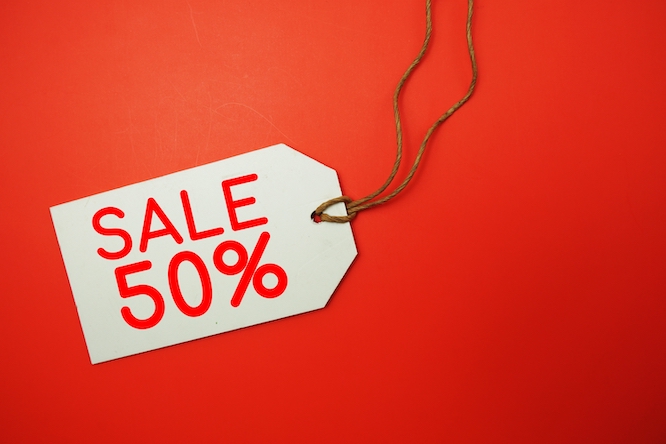 Sale 50% off tag with space copy on red background