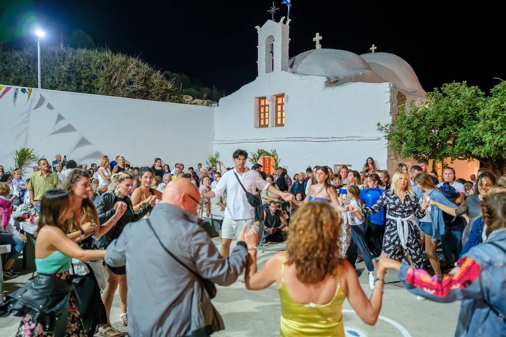 Ios, Greece - September 7, 2023 : 7, 2022 : View of a traditional festival in Ios Greece where locals and tourists dancing and celebrating the Holy Mary at the church of Agia Theodoti
