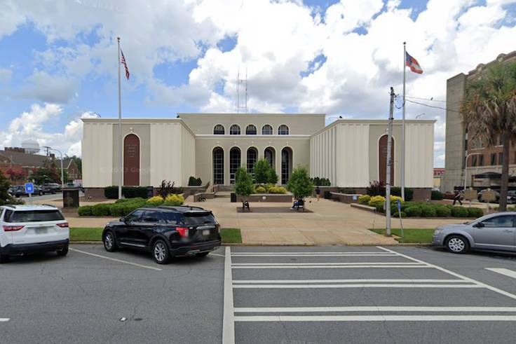 Albany Municipal Court with cars parked out front