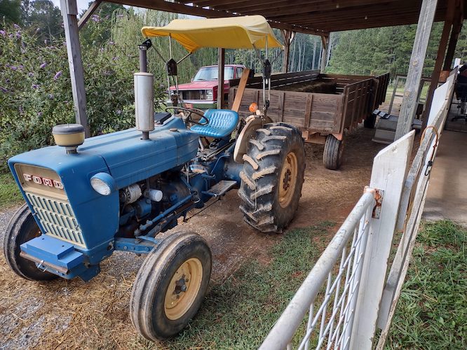 huge blue tractor on a farm
