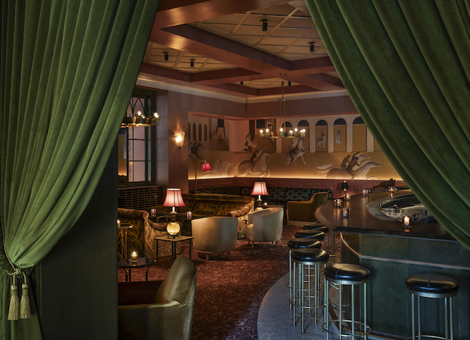 fancy restaurant in old fourth ward with green curtains and warm tones