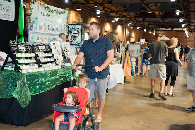 man with a stroller at a market
