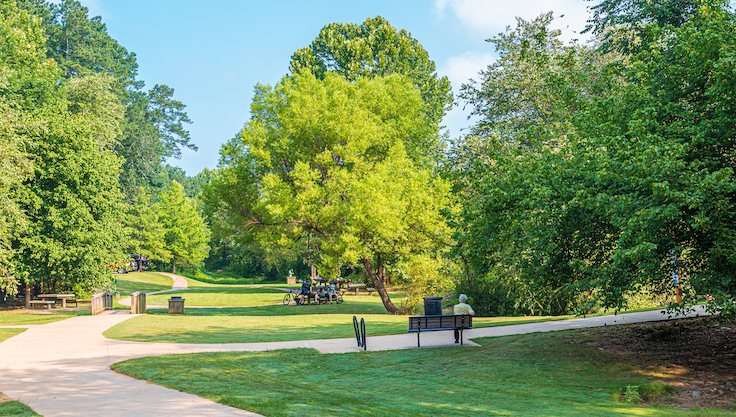 ATLANTA, GEORGIA - July 22, 2017: Parks are emerging as important public health solutions in urban communities. Research confirms that nearby parks and green spaces support human health and wellness.