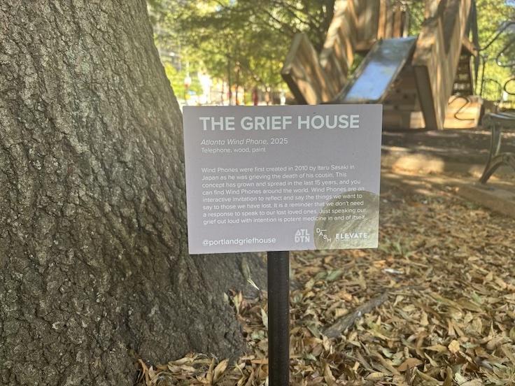 a plaque explaining what a Wind Phone is