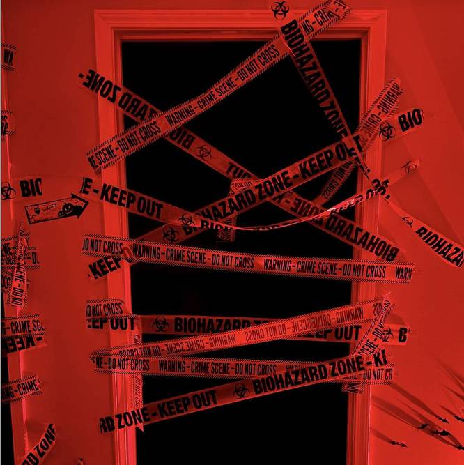 caution tape on a door for spooky halloween decor