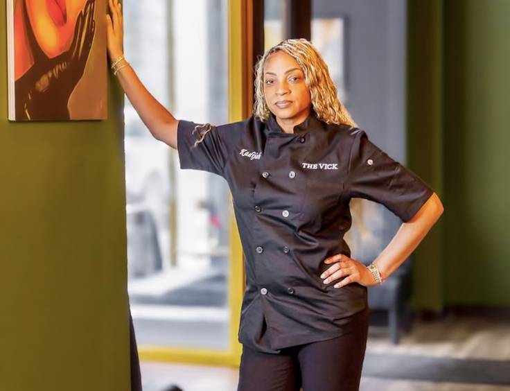 woman in an all black chef outfit