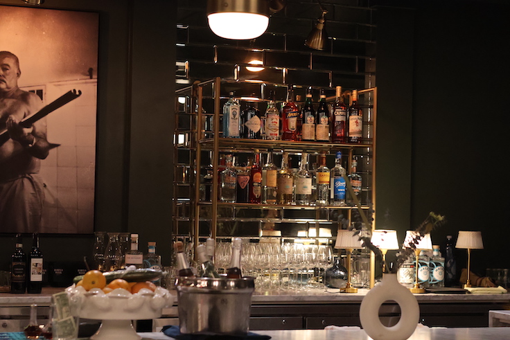 a dark moody, fully-stocked bar