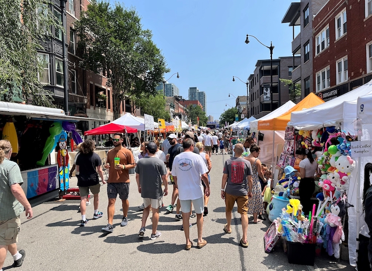 CHICAGO - JULY 23, 2023: People Stroll and Browse Local Vendors at Lincoln Park Fest Street Fair on July 23, 2023 in Chicago. The city  hosts a number of summer street fairs each year.