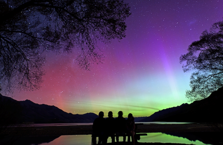 Family watching the Southern Lights, Lake Wakatipu, New Zealand