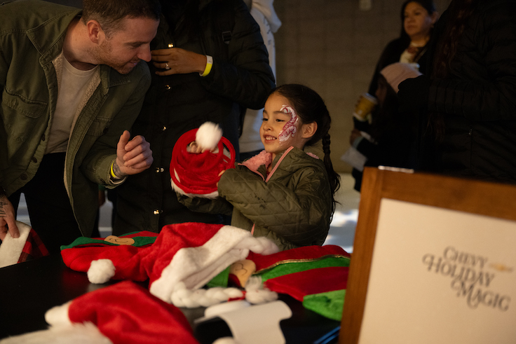 little girl with holiday face paint