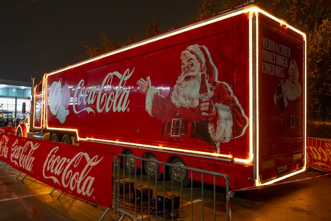 Santa Claus' Coca-Cola Christmas truck, side view; Austria, Vienna, December 5, 2023.