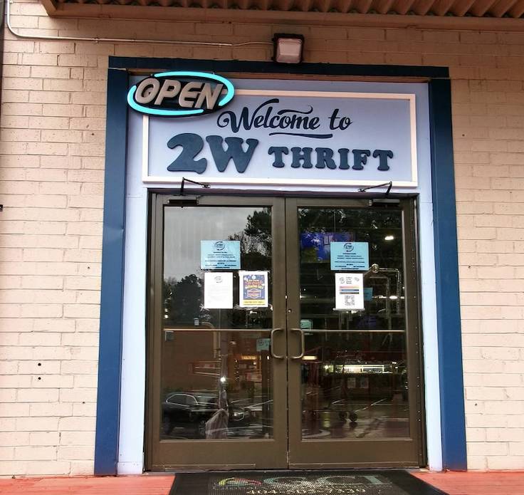 huge vintage fashion spot exterior doorway with an open sign