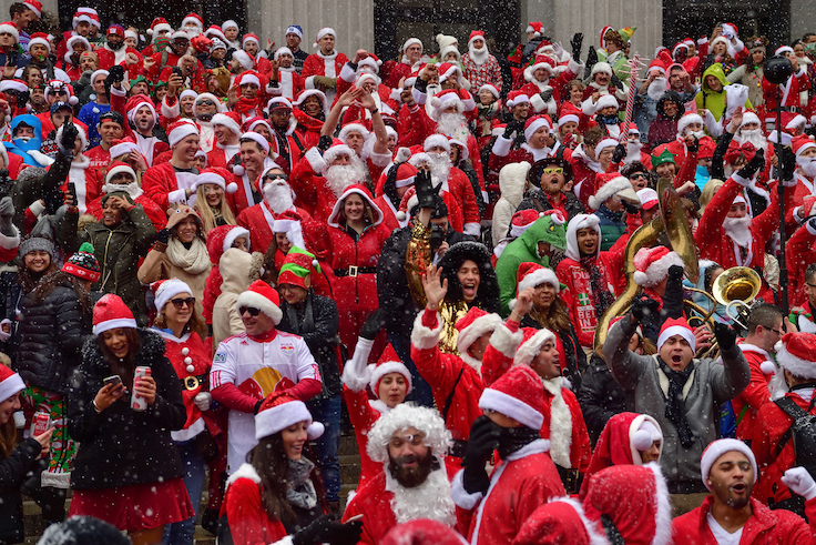 NEW YORK, USA – DECEMBER 9. 2017: People gather and cerebrate with Santa costume during SantaCon, annual festivity in Manhattan, New York