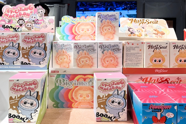 Dubai, UAE - May 18, 2025: Pop Mart blind box toys including Labubu, Exciting Macaron, Biginto Pretty, Crybaby Powerpuff Girls on display in trendy toy store. Popular figures seen on TikTok and reels