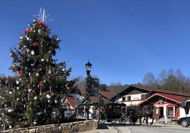 downtown Helen, GA with tons of Christmas decor and a giant Christmas tree