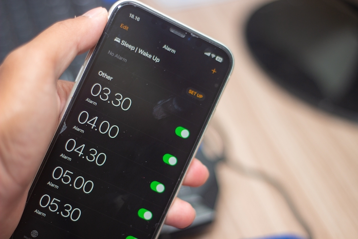 Bandung, Indonesia June 2023 : Hand holding iPhone with the screen