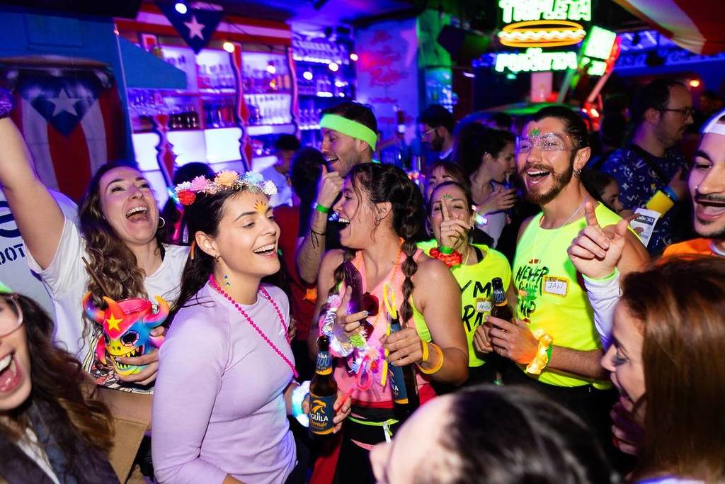 New friends together drinking at the afterparty at Luminous Party Run