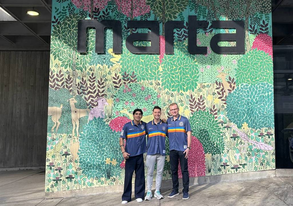 three men pose with a world record in front of the MARTA sign