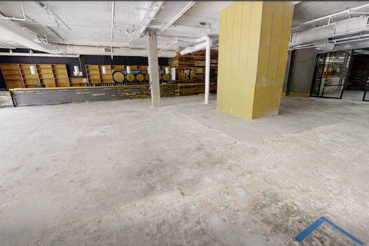 open warehouse room that will turn into a comedy club