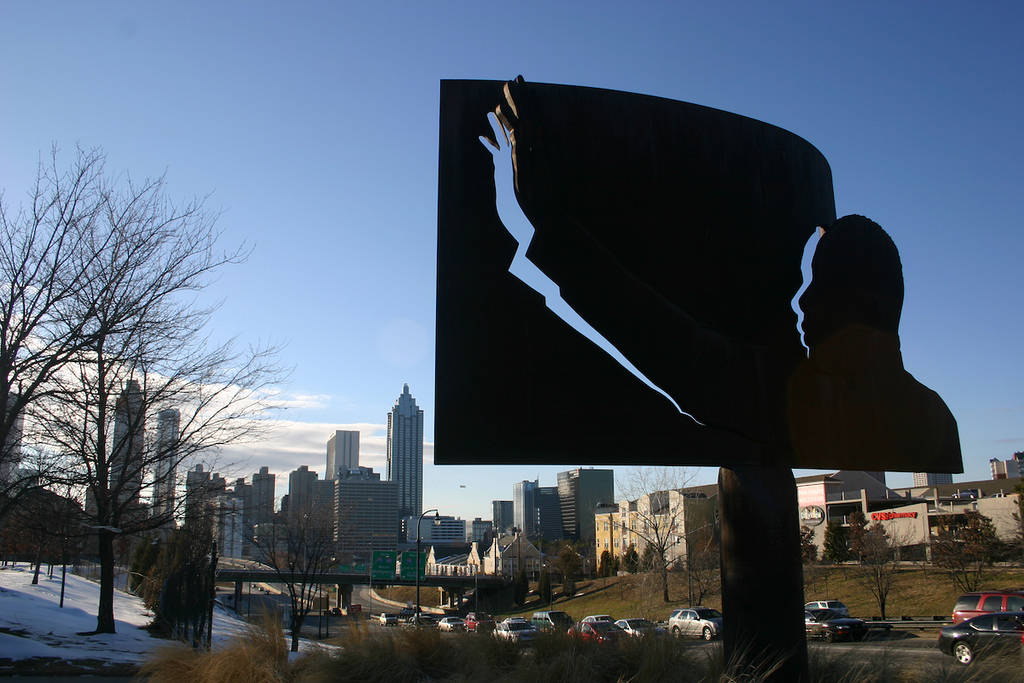 ATLANTA - JAN 15: On what would have been his 82nd birthday, a statue of Martin Luther King Jr stands over the Atlanta skyline on January 15, 2011, two days before the holiday in his honor.