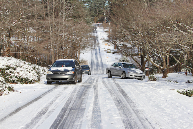 Abandoned vehicles in neighborhood,after a major winter storm hit Atlanta. Lilburn ,Georgia. January 10,2014