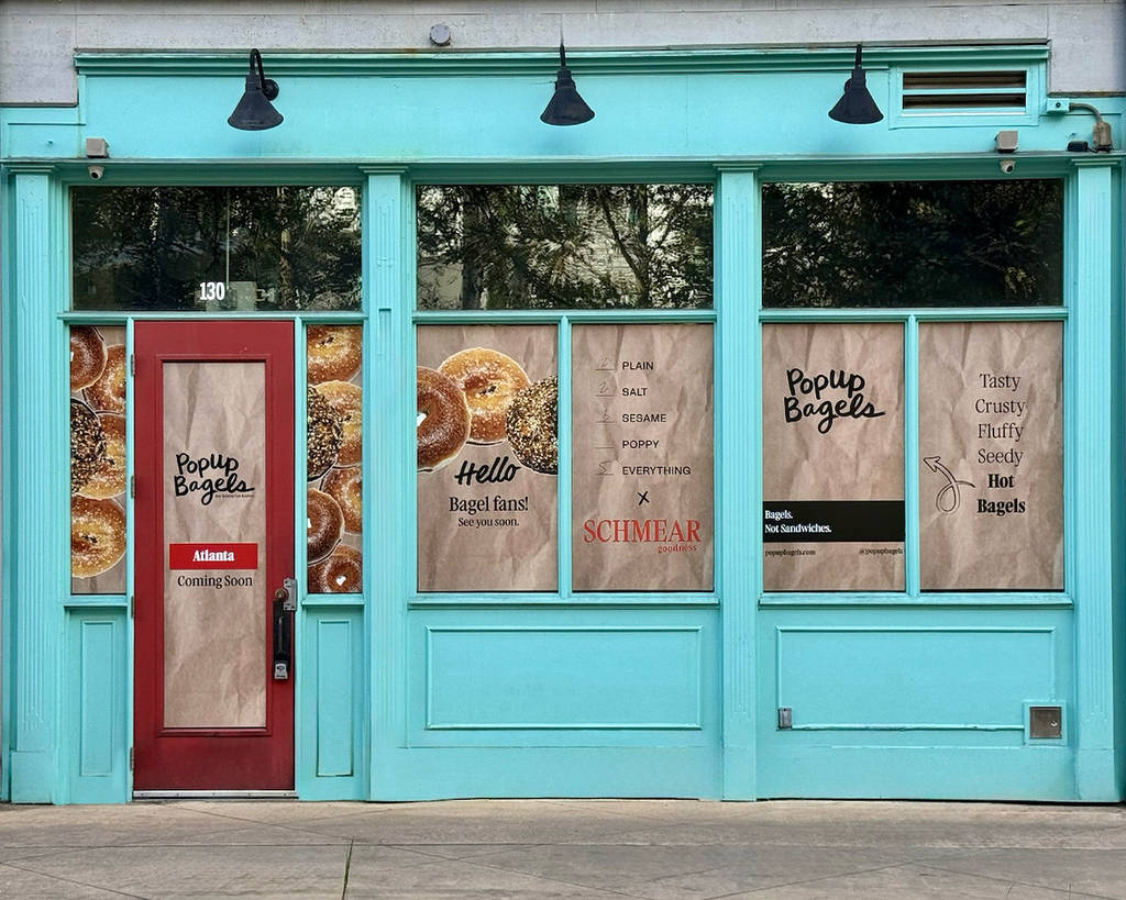 storefront of a bagel shop in Tiffany blue