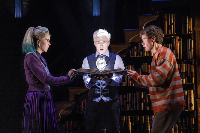 three young wizards in a stage play of Harry Potter and the Cursed Child