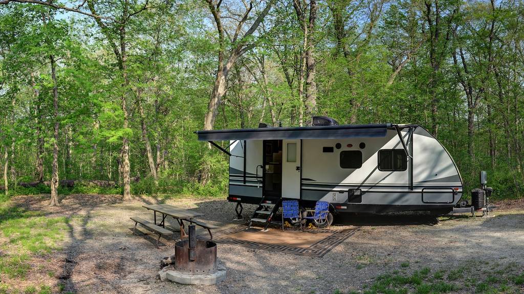 Travel trailer camping in the woods at starved rock state park illinois
