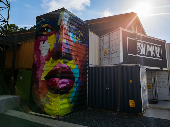 large mural of a face in rainbow colors