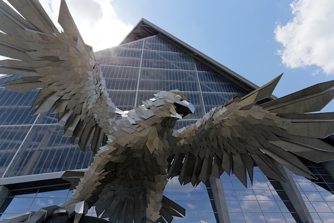 ATLANTA - APRIL 20: A large falcon statue near the entrance of Mercedes-Benz Stadium in Atlanta, Georgia on April 20, 2021. Mercedes-Benz Stadium is the home stadium of the Atlanta Falcons of the NFL.
