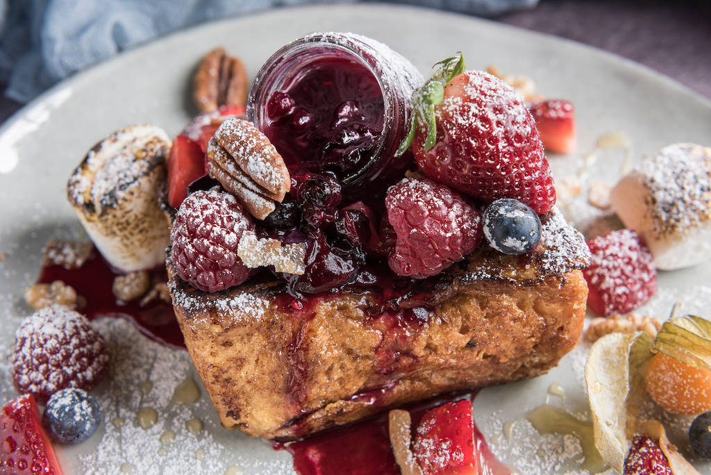Gourmet brioche french toast with berries and marshmallows. Horizontal.