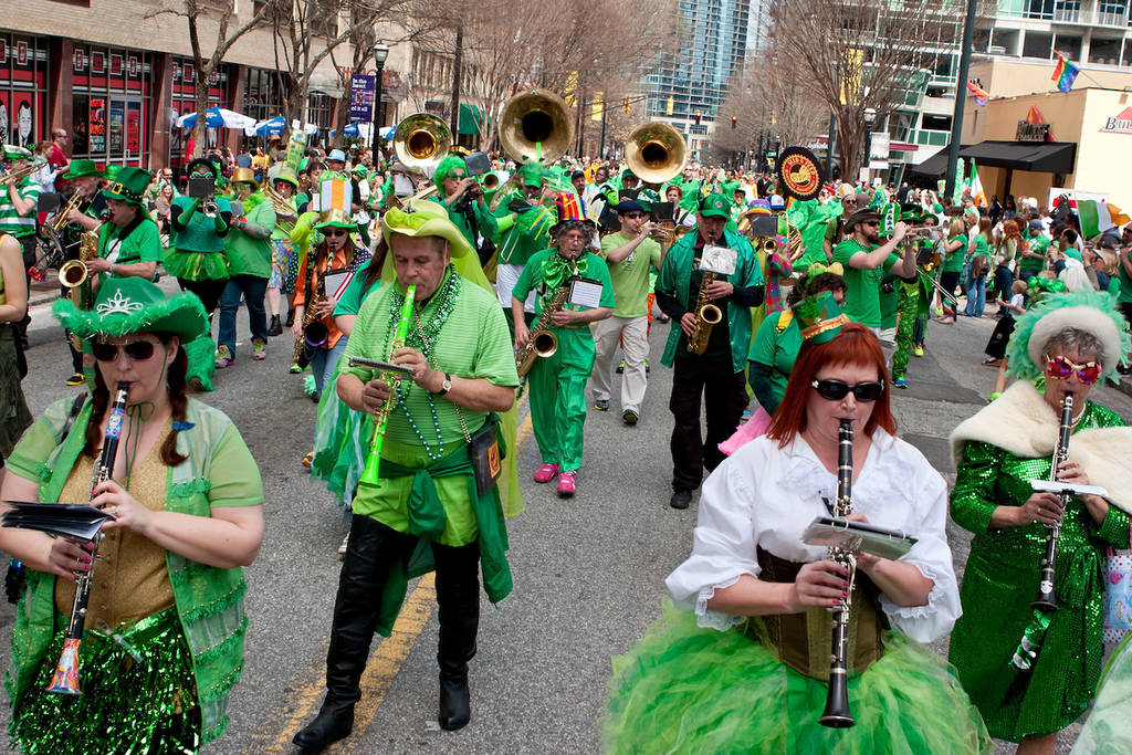 ATLANTA, GA - MARCH 15: A band dressed in eclectic green costumes plays while marching in the St. Patrick's parade down Peachtree Street, on March 15, 2014 in Atlanta, GA.