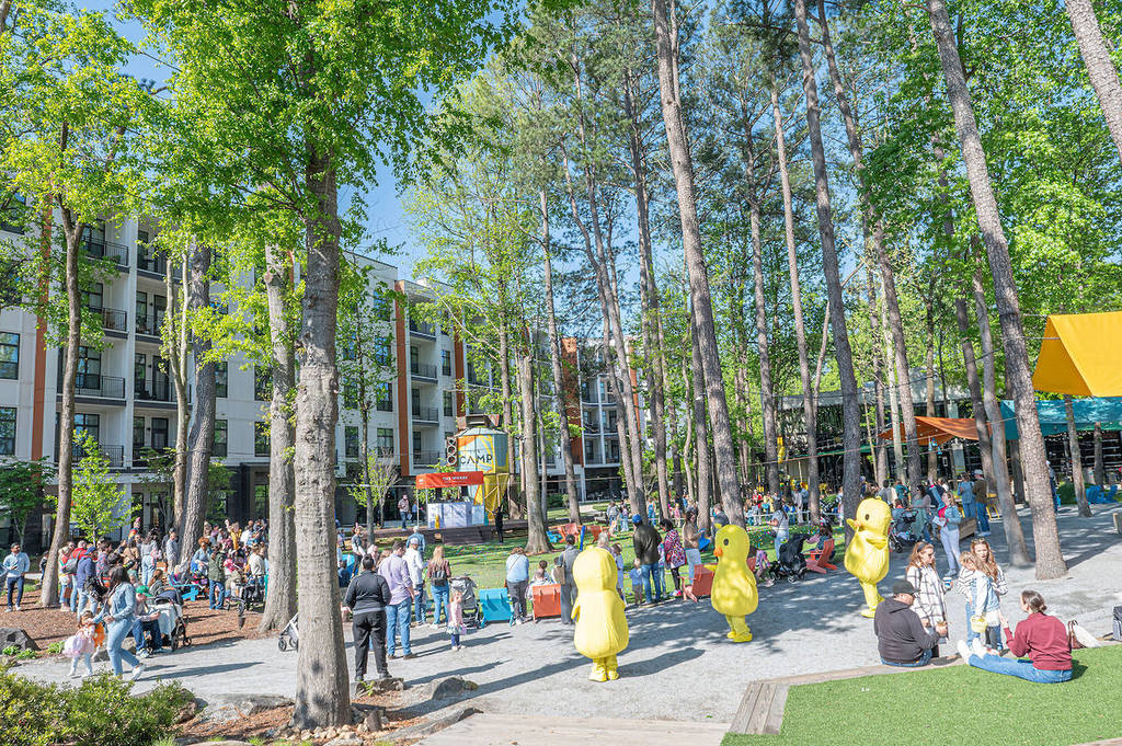 an easter egg hunt with giant duck costumes