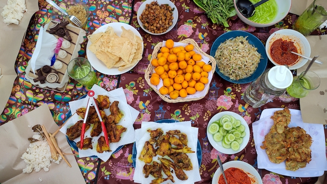 Various food buffet seved an floor dining style with bokeh background. indonesian culture traditional cuisine. Often in ramadan month and islam eid al fitr and al adha celebration