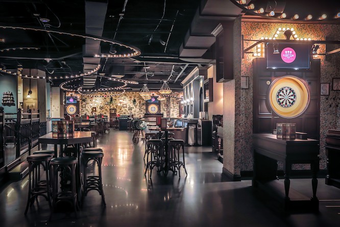 a pretty bar with darts