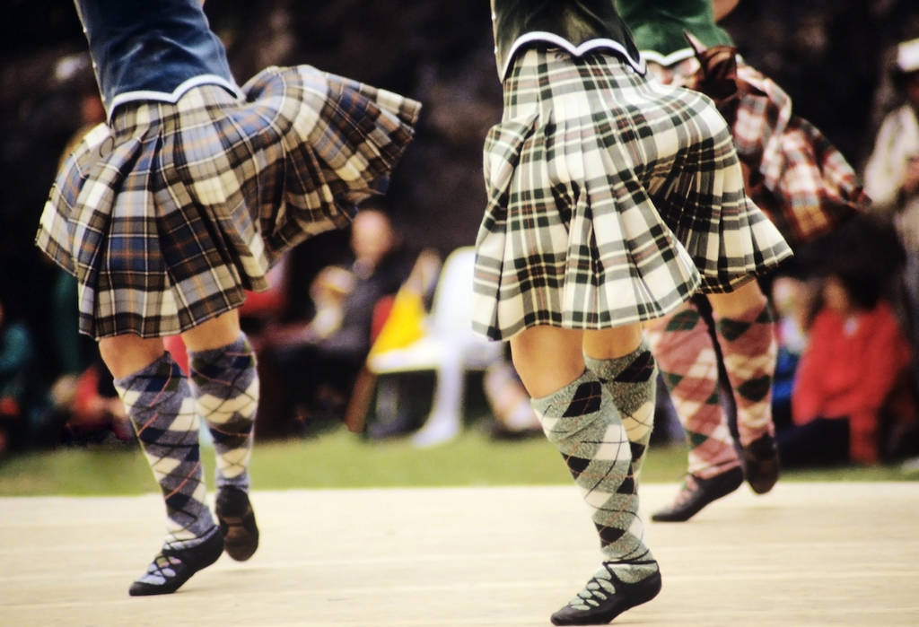 highland dancers at a highland games in scotland, uk