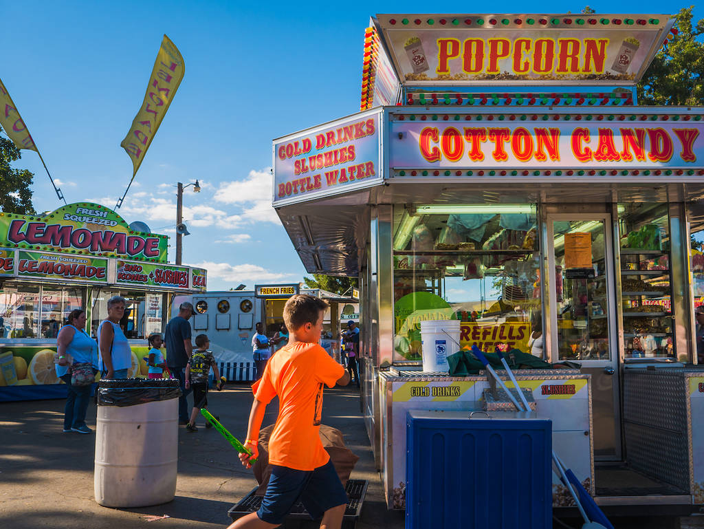 CHAMPAIGN, IL - July 27, 2017: Kids run and play at the annual Champaign County Fair in the state of Illinois