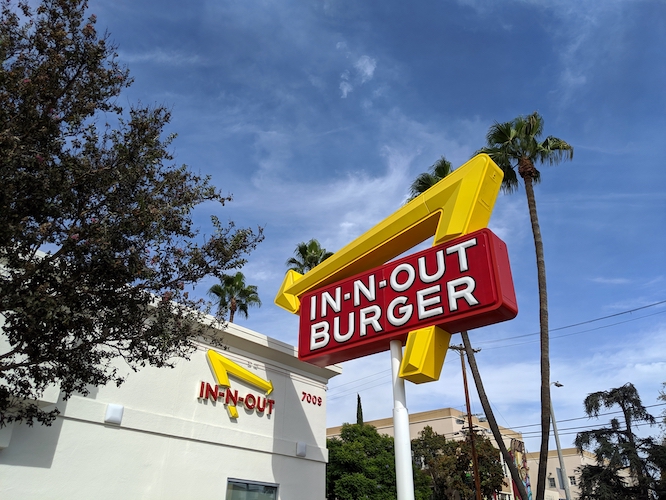 LA, California, United States - October 16, 2019: Exterior Sign and In-N-Out Burger restaurant. In-N-Out Burgers, Inc. is a regional chain of fast food restaurants with locations the United States.