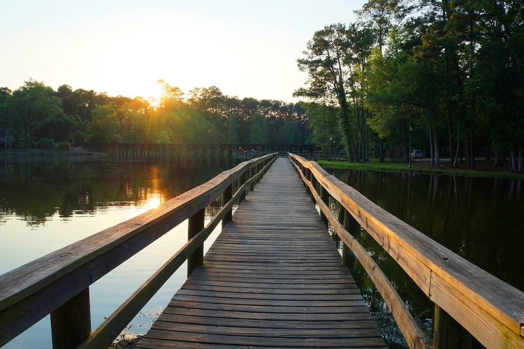 Walking path over a lake at sunset in Thomasville Georgia