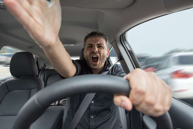 Angry man driving a vehicle