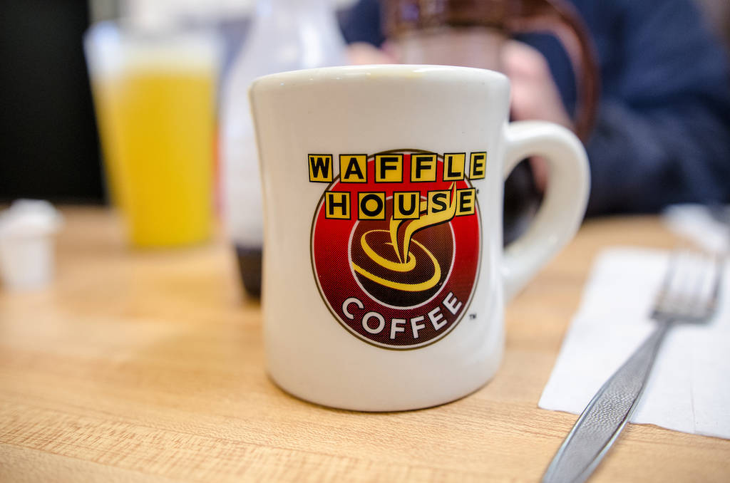 DECEMBER 15 2018- ATLANTA GEORGIA: Waffle House logo coffee cup inside the breakfast restaurant. Focus only on the logo on the coffee cup for artistic emphasis