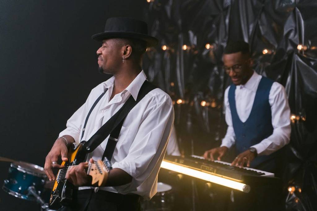 a pianist and guitarist performing at a live jazz show