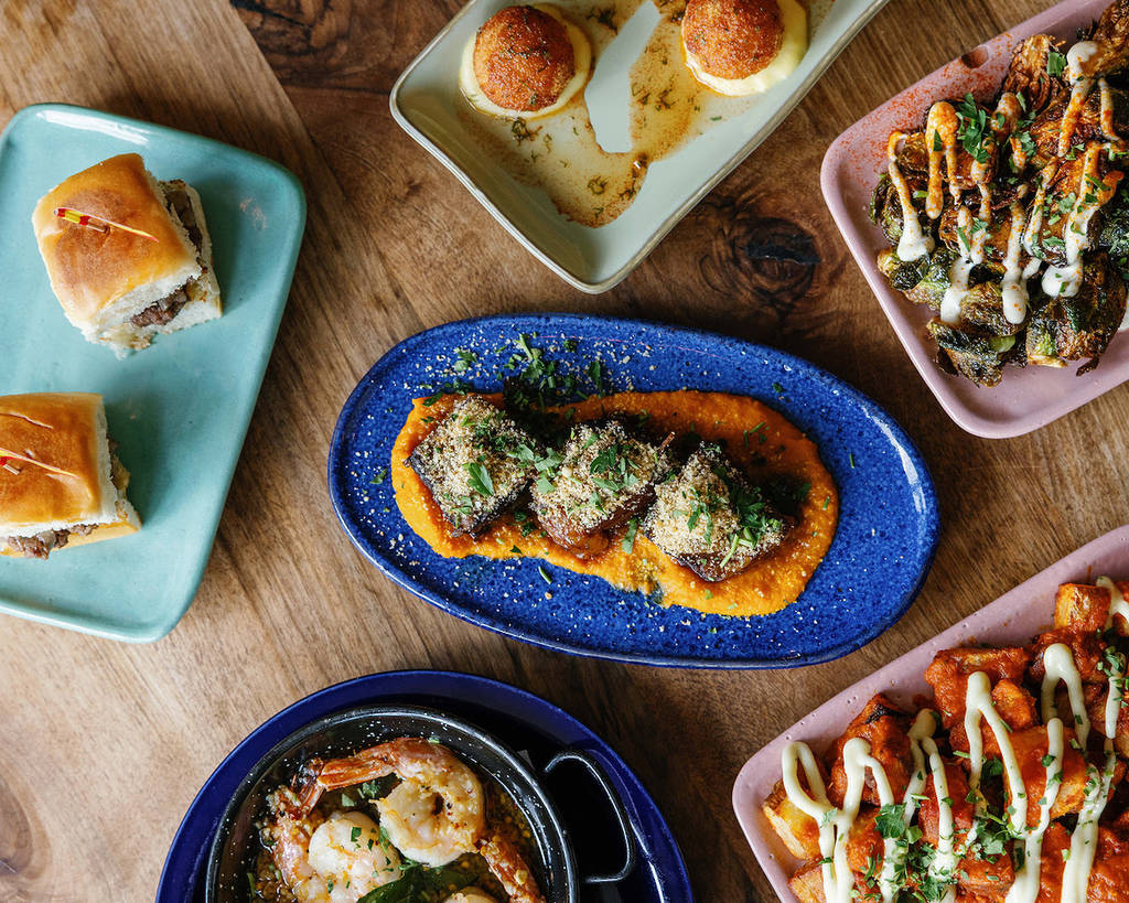 shareable tapas on colorful plates