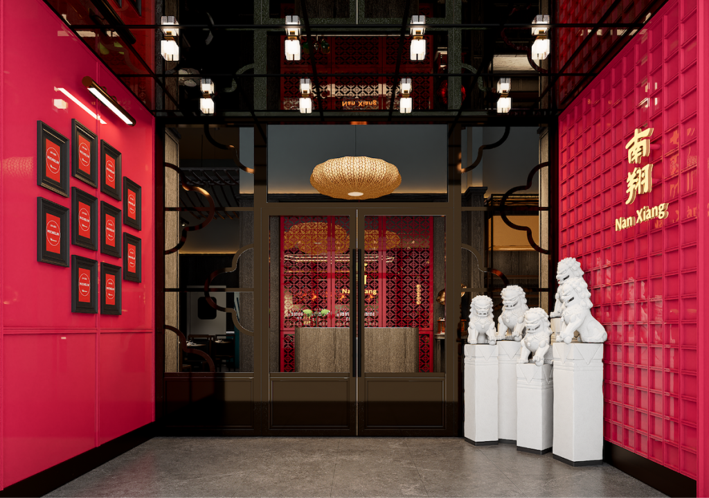 a traditional Chinese door with dragon sculptures
