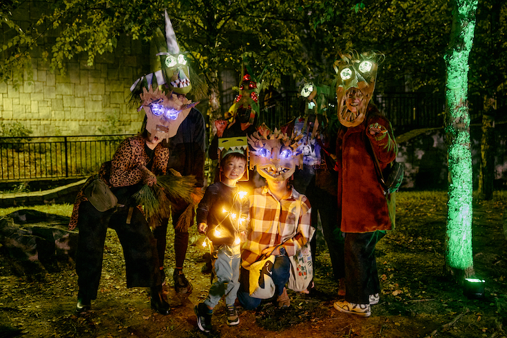 people wearing cardboard masks