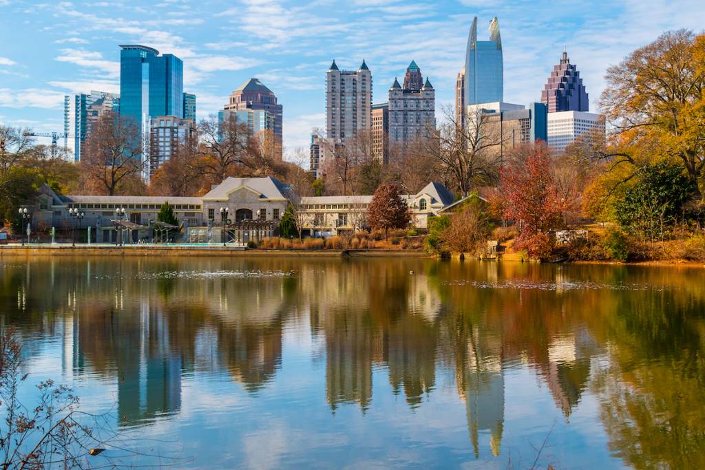 View of Lake Clara Meer, Piedmont Park Aquatic Center and Midtown Atlanta in sunny autumn day, USA