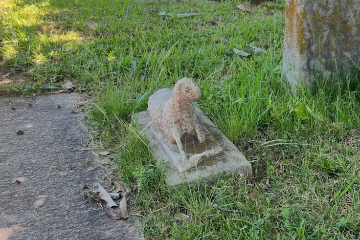 Tweet's headstone, A grave w a lamb on it